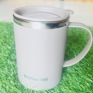 Home insulated coffee mug with handle on desk