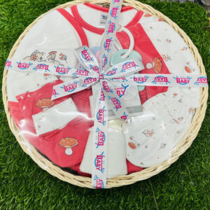 Home Mommas Baby 10 pcs newborn baby gift basket set top view in clear gift wrap with ribbon on green grass